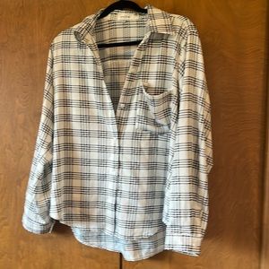 Nice blouse. M but fits like a L.  100% Polyester